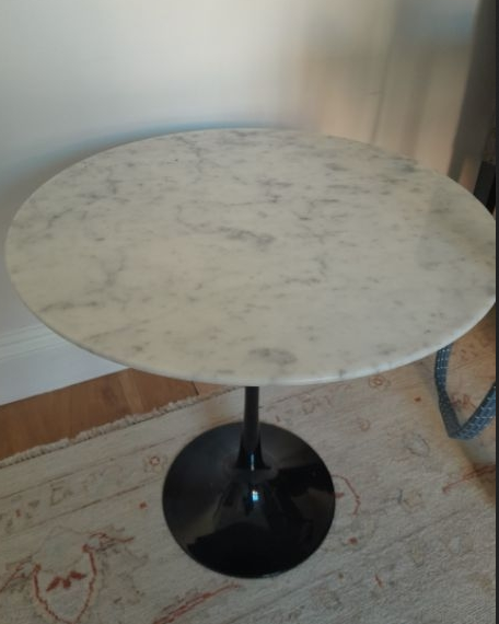 round marble tulip table with black base